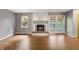 Inviting living room with fireplace, hardwood floors, and access to screened-in porch for indoor-outdoor living at 961 Parkside Dr, Columbus, IN 47203