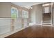 Bright living room with custom shelving, hardwood floors, and view of front yard, creating a cozy atmosphere at 961 Parkside Dr, Columbus, IN 47203
