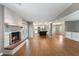 Spacious open-concept living room with fireplace, hardwood floors, and access to kitchen and backyard at 961 Parkside Dr, Columbus, IN 47203