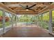 This beautiful covered porch offers an outdoor space to relax and enjoy the scenery at 961 Parkside Dr, Columbus, IN 47203