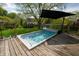 This backyard outdoor spa pool is set in a wood deck perfect for relaxing on a hot day at 961 Parkside Dr, Columbus, IN 47203