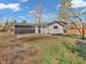 View of the private backyard with lush greenery and a small patio area at 9829 Chambray Dr, Indianapolis, IN 46280