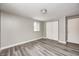 Neutral bedroom featuring hardwood floors, closet doors, one window, and neutral paint at 9829 Chambray Dr, Indianapolis, IN 46280