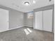 Bedroom featuring a window, closet, and neutral-colored walls and carpet at 9829 Chambray Dr, Indianapolis, IN 46280