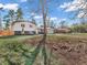 Charming home exterior with a well-manicured lawn and mature trees at 9829 Chambray Dr, Indianapolis, IN 46280