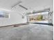 Spacious garage with open door and ample space for parking and storage at 9829 Chambray Dr, Indianapolis, IN 46280