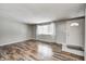 Inviting living room with beautiful flooring, a large window for natural light, and neutral paint at 9829 Chambray Dr, Indianapolis, IN 46280
