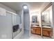 Functional bathroom with a shower and dual sink vanity for everyday convenience at 9855 Haven Ct, Indianapolis, IN 46235