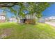 Exterior showcasing the townhome's architecture in a residential setting, nestled among mature trees at 9855 Haven Ct, Indianapolis, IN 46235