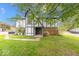 Charming townhome featuring a well-maintained lawn and classic Tudor-style architecture at 9855 Haven Ct, Indianapolis, IN 46235