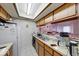 This practical kitchen features double sink and storage solutions, ready for your personal touch at 9855 Haven Ct, Indianapolis, IN 46235