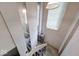 Interior shot of the stairway with mirrors and a landing looking down from the top at 9855 Haven Ct, Indianapolis, IN 46235