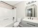 Bathroom with gray vanity and black fixtures, a shower and tub at 10362 Delphi Ct, Fishers, IN 46038