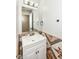 Stylish bathroom showcasing a vanity with decorative backsplash and updated lighting at 10362 Delphi Ct, Fishers, IN 46038