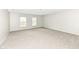 Spacious bedroom with carpeted floors and large windows at 10362 Delphi Ct, Fishers, IN 46038