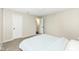 Bedroom with carpet, a bed, and two doors, one of which leads to the bathroom at 10362 Delphi Ct, Fishers, IN 46038