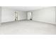 Large carpeted bedroom with multiple closets and doorways at 10362 Delphi Ct, Fishers, IN 46038