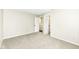 Carpeted bedroom with neutral paint and trim, an open closet, and a bathroom at 10362 Delphi Ct, Fishers, IN 46038