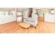 Inviting living room featuring hardwood floors, natural light, and a modern decor at 10362 Delphi Ct, Fishers, IN 46038