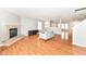 Living room featuring a fireplace, hardwood floors, and neutral paint at 10362 Delphi Ct, Fishers, IN 46038