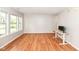 Bright living room with hardwood floors and many windows at 10362 Delphi Ct, Fishers, IN 46038
