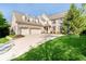 Spacious two-story home features a three-car garage, dormer windows, and mature landscaping at 10752 Tallow Wood Ln, Indianapolis, IN 46236