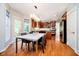 Eat-in kitchen features stainless appliances, cherry wood cabinets, and a table with chairs at 10752 Tallow Wood Ln, Indianapolis, IN 46236
