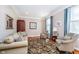 Cozy living room with comfortable seating, hardwood floors, and natural light at 10752 Tallow Wood Ln, Indianapolis, IN 46236