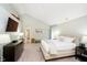 Spacious main bedroom featuring vaulted ceiling, stylish decor, and comfortable bed at 10752 Tallow Wood Ln, Indianapolis, IN 46236