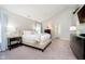 Serene main bedroom with neutral tones, vaulted ceiling, and ample space at 10752 Tallow Wood Ln, Indianapolis, IN 46236
