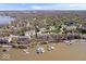 Stunning aerial view of lakeside condos featuring private boat docks and lush landscaping at 11264 Fonthill Dr, Indianapolis, IN 46236