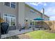 Backyard patio with a seating area, grill, and well-maintained lawn at 11264 Fonthill Dr, Indianapolis, IN 46236