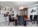 Bright dining room with wooden furniture and an open view to the kitchen at 11264 Fonthill Dr, Indianapolis, IN 46236