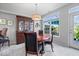 Dining room with natural light, a stylish light fixture, and beautiful wooden furniture at 11264 Fonthill Dr, Indianapolis, IN 46236