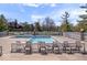 Community swimming pool with lounge chairs, fence, and landscaping at 11264 Fonthill Dr, Indianapolis, IN 46236