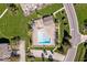 Aerial view of a community pool with a picnic shelter and beautiful landscaping at 11264 Fonthill Dr, Indianapolis, IN 46236