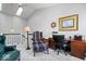 Upper level sitting room with bright natural light, carpeted floors, and a wooden desk at 11264 Fonthill Dr, Indianapolis, IN 46236