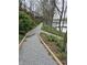Scenic walking path along the water's edge, offering serene views and a peaceful atmosphere at 11264 Fonthill Dr, Indianapolis, IN 46236