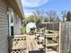 Relaxing deck area perfect for outdoor dining, featuring backyard views, privacy fence and convenient shed at 1136 Lawrence Ave, Indianapolis, IN 46227