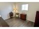 Inviting bedroom showcasing hardwood floors, a decorative lamp, and ample natural light at 1136 Lawrence Ave, Indianapolis, IN 46227