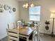 Bright dining room with a wooden table set, perfect for Gathering meals, complemented by stylish decor at 1136 Lawrence Ave, Indianapolis, IN 46227