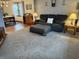 Comfortable living room showcasing plush carpeting, neutral wall colors, and natural light, perfect for relaxation at 11786 Ledgestone Cir, Fishers, IN 46037