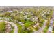 Overhead perspective of a cozy neighborhood, highlighting green spaces and well-spaced homes at 1213 Fairview Dr, Greenfield, IN 46140