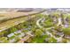 Scenic aerial of a neighborhood with green spaces, proximity to fields, and community amenities at 1213 Fairview Dr, Greenfield, IN 46140