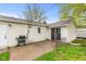 Cozy back patio with a grill, sliding doors, and a small yard, ideal for outdoor cooking and relaxation at 1213 Fairview Dr, Greenfield, IN 46140