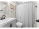 Bathroom featuring a sink, shower with curtain and modern finishes at 1213 Fairview Dr, Greenfield, IN 46140