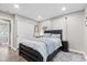 This bedroom features a large bed, wood-look floors, and a closet at 1213 Fairview Dr, Greenfield, IN 46140