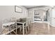 Dining room with wood table and chairs set and views to the living room at 1213 Fairview Dr, Greenfield, IN 46140