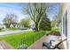 View from front porch looking out to street and showcasing the home's green lawn at 1213 Fairview Dr, Greenfield, IN 46140