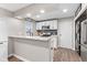 Renovated kitchen with white cabinets, granite countertops, and stainless appliances at 1213 Fairview Dr, Greenfield, IN 46140